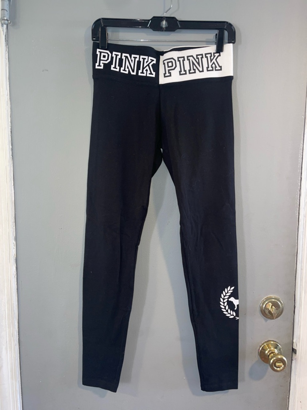 Pink leggings with two tone waistband & crest on side of left leg size S